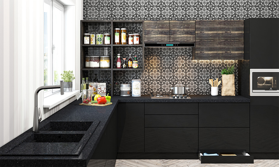 Bold black granite quartz kitchen sink and black slab in the l-shaped kitchen are odour-resistant and super hygienic.