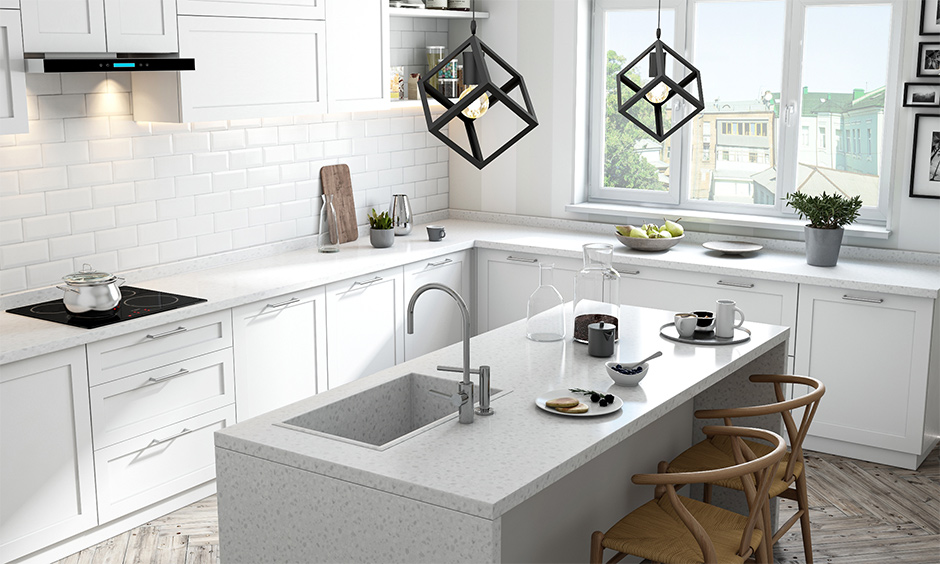 Best quartz kitchen sink in frosty white island kitchen, it has white drawers and white cabinets for easy storage.