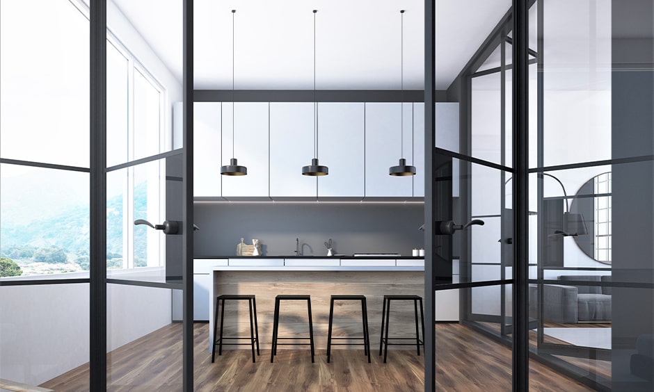 Black-framed bi-fold kitchen glass design door