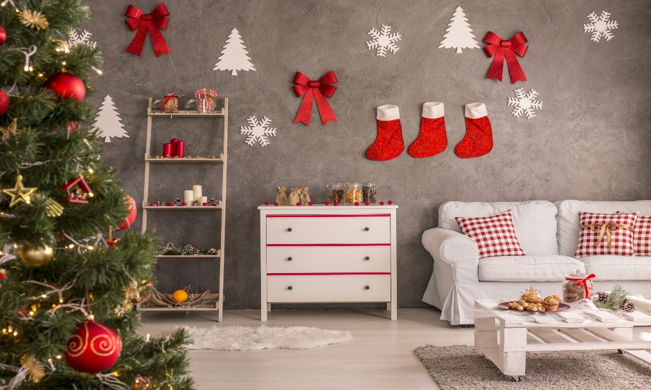 Red colour Christmas ribbon decoration on wall with snowflakes