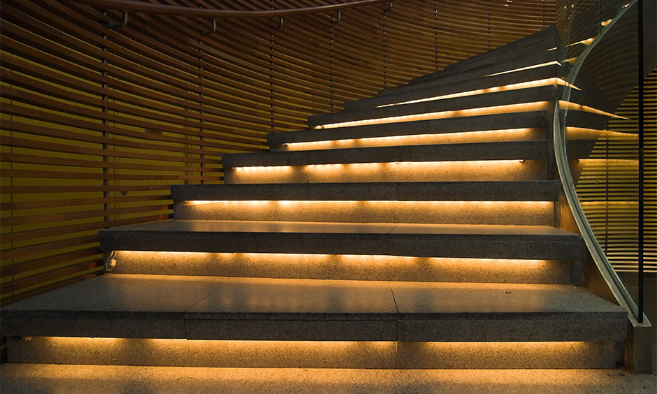 Contour modern staircase lighting designed with LED strips under stair look incredibly chic.