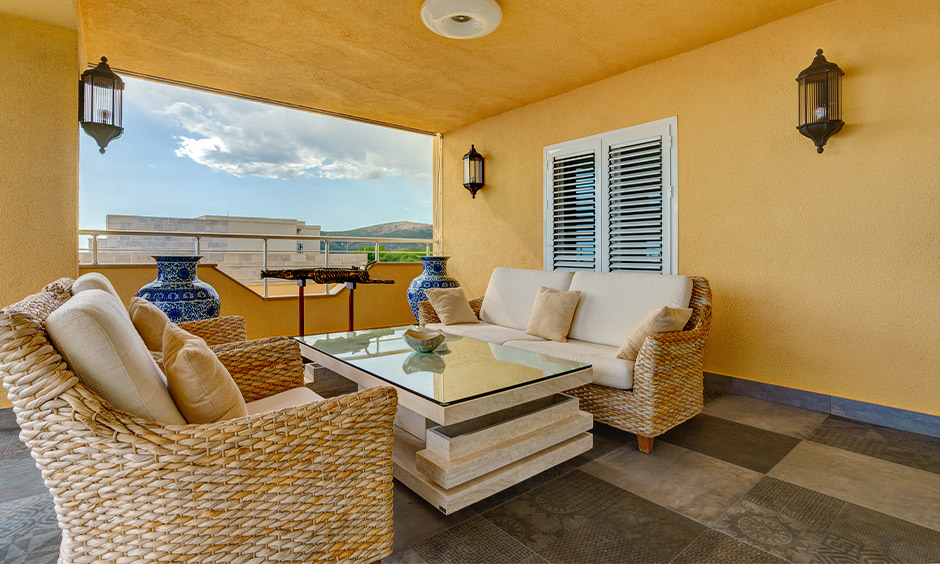 Modern balcony floor tiles design in glazed vitrified matt finish adds a classy touch to the area.