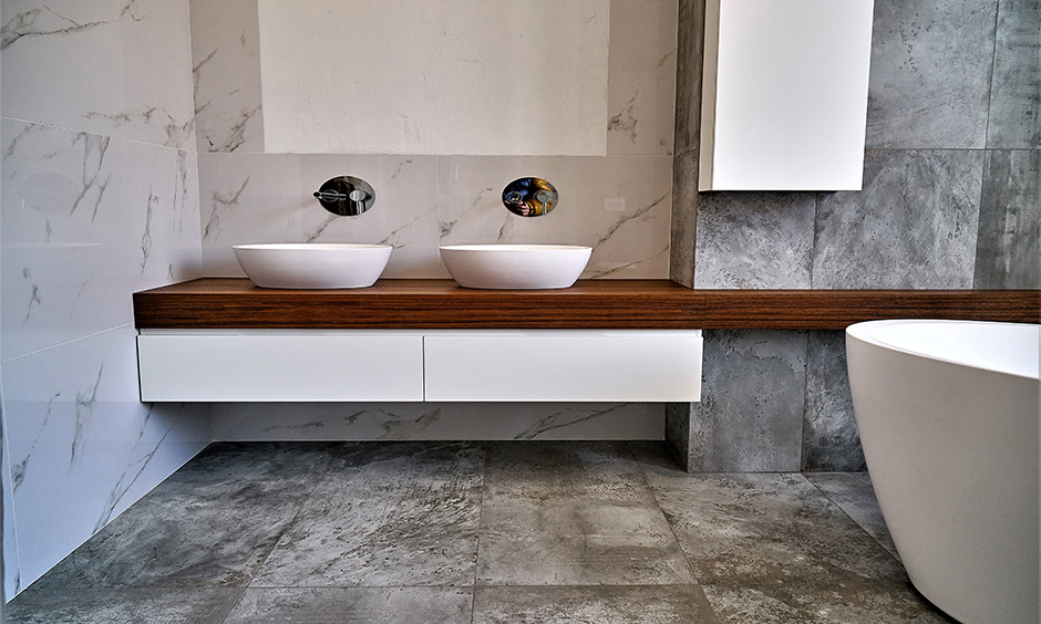 Wood bathroom countertop with two sinks in a modern bathroom looks aesthetic