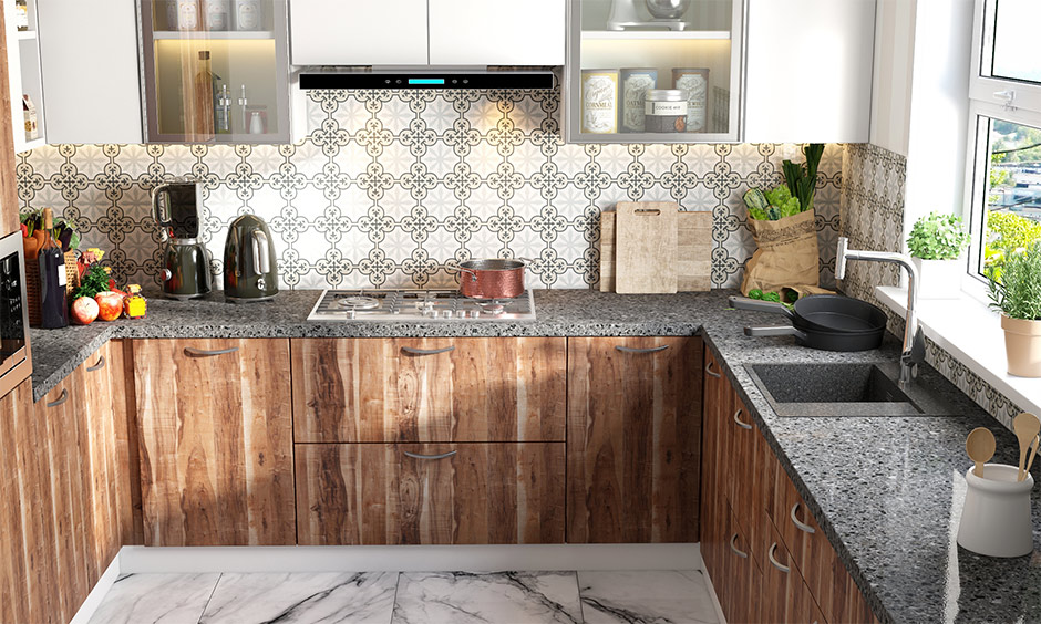 Grey quartz kitchen sinks and a grey granite slab in this kitchen with wooden cabinets look rustic.