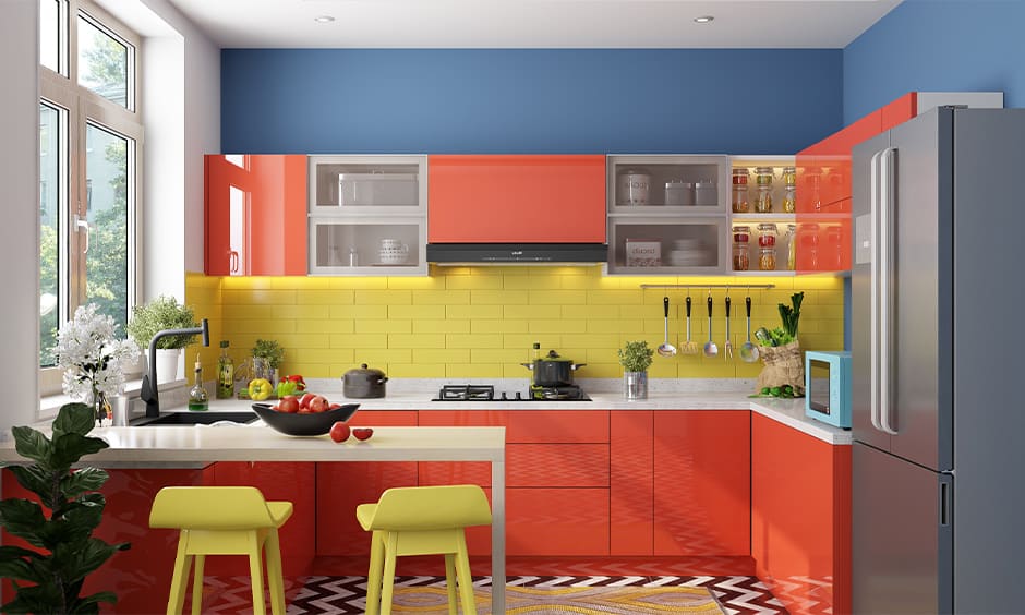 Kitchen with a red-and-yellow theme and glass shutter cabinets