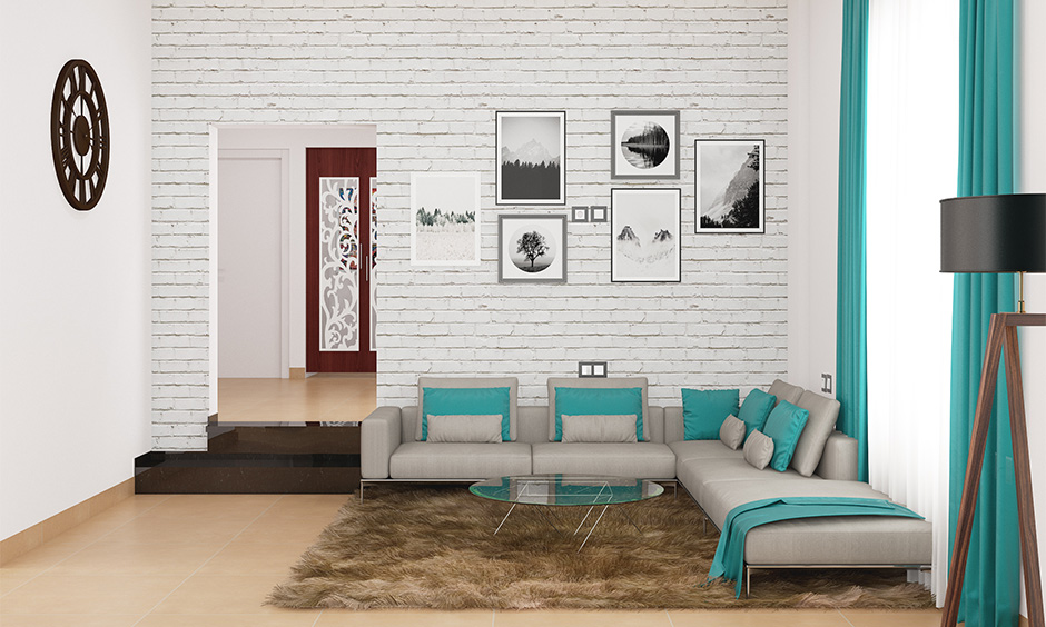 Minimal drawing room decoration with a colour scheme, the rug and the wall artsy looks bright and welcoming.