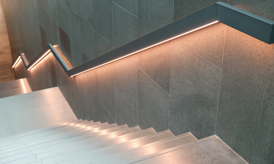 Staircase wall light designed under the railing with led strip transforms home into an abode of calm and serenity.