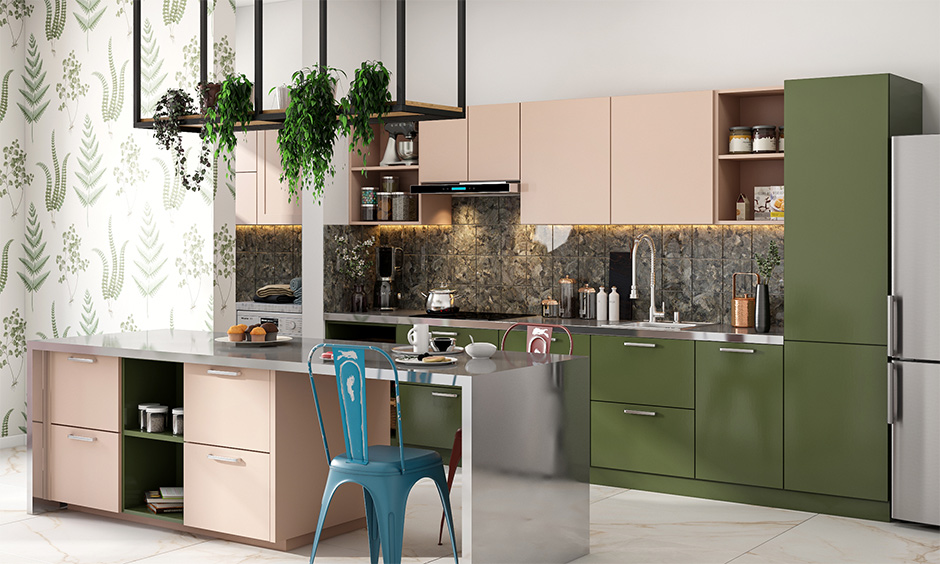 Countertop stainless steel kitchen island in an olive-green-and-pink-themed with backsplash in grey brings aesthetic.