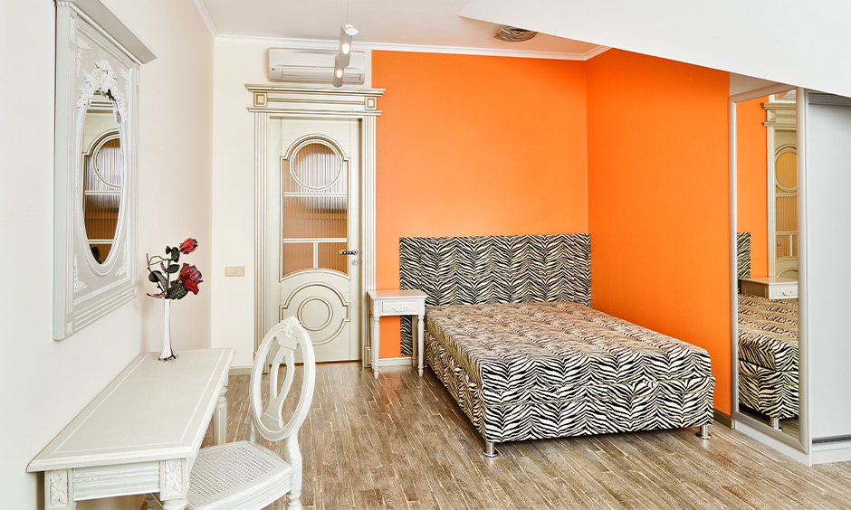 Orange and white wall light colour combination for small bedroom