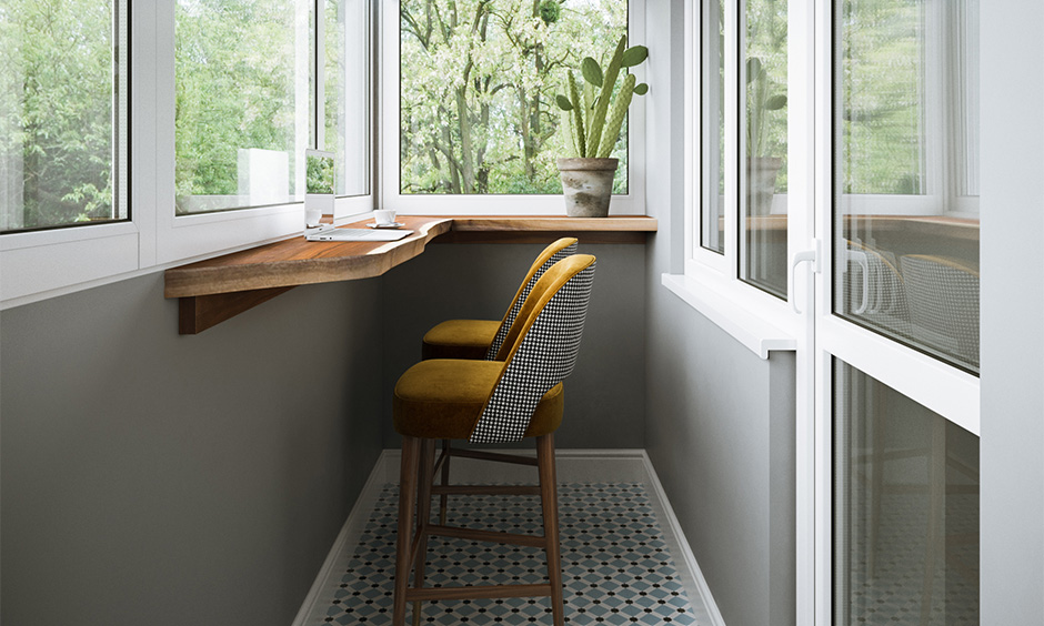 Small balcony tiles design in porcelain patterned with two seating chairs is bright and welcoming.