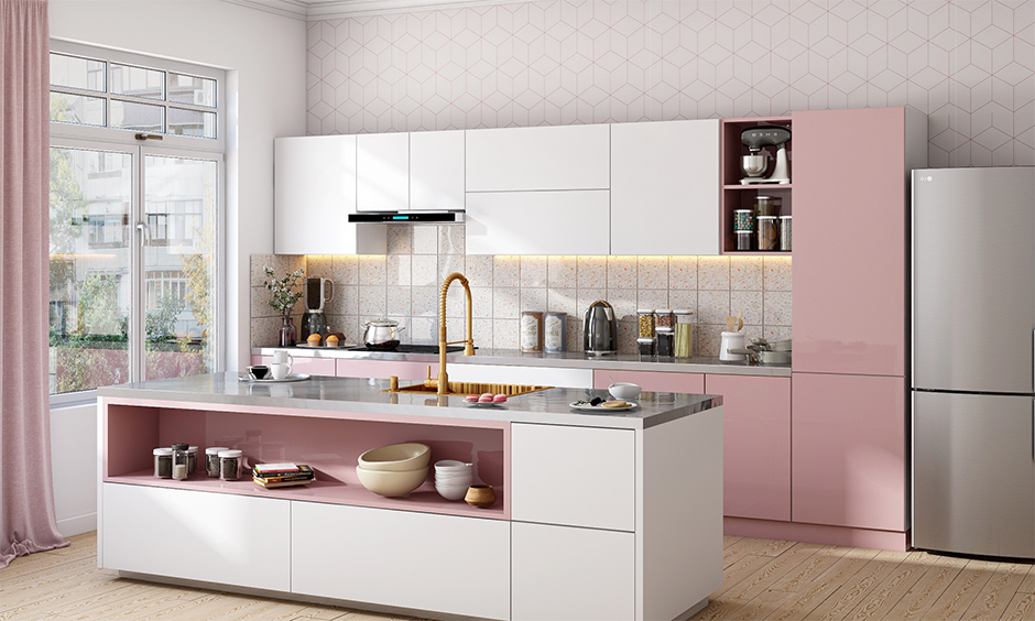 Stainless steel kitchen island table in pink-theme, white-tiled backsplash beautifully blends with the kitchen.