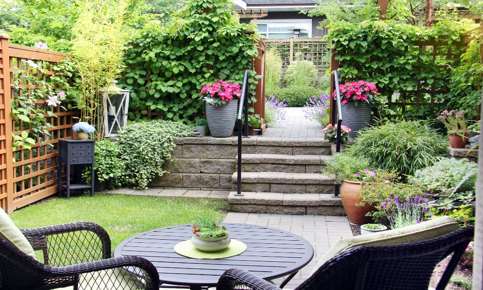 Zen garden design with earthy stones and antique corner shelves and chairs is the simple terrace garden ideas.