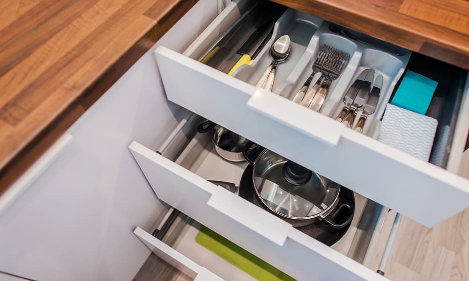 Kitchen cabinet drawer with pots and pan organizer