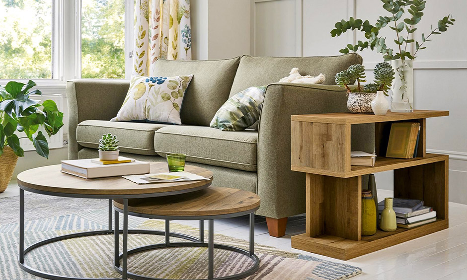 Circle center table decorated with arranged magazines and mini planters gives it a holistic look.