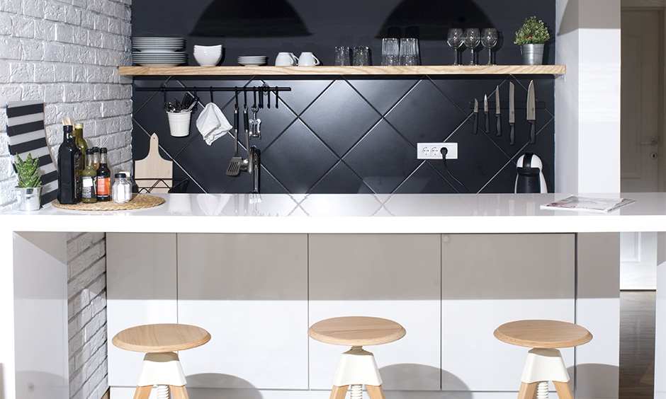 Minimalistic modern home bar design for small space, a combination of black and white brings a cosy yet modern vibe.