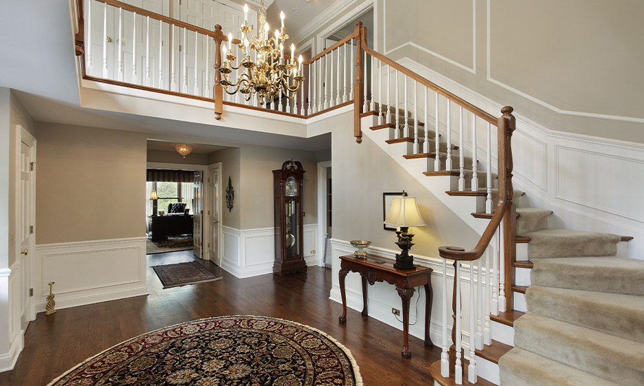 Hanging lights for staircase, gold chandelier adds a unique piece of art to create a sense of intimate luxury.