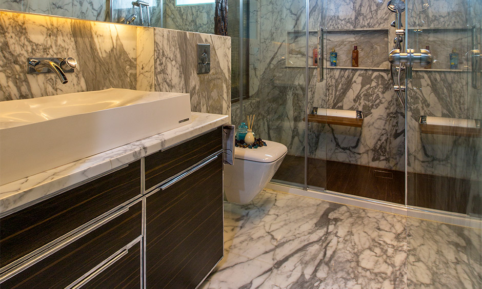 Independent house interior design, bathroom designed with wooden cabinet and marble flooring look classy.