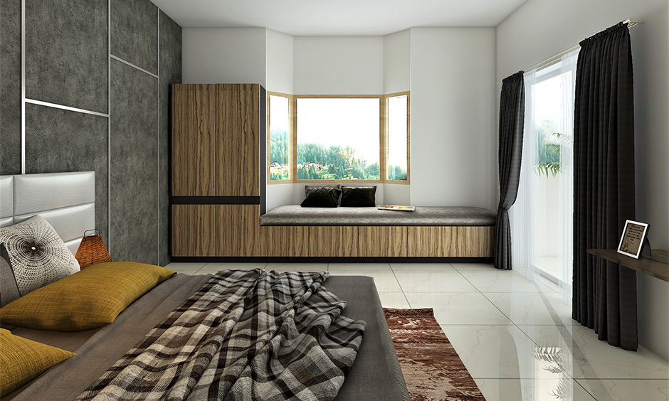 Bedroom window glass design with two angled side windows and cosy seating area brings calmness.