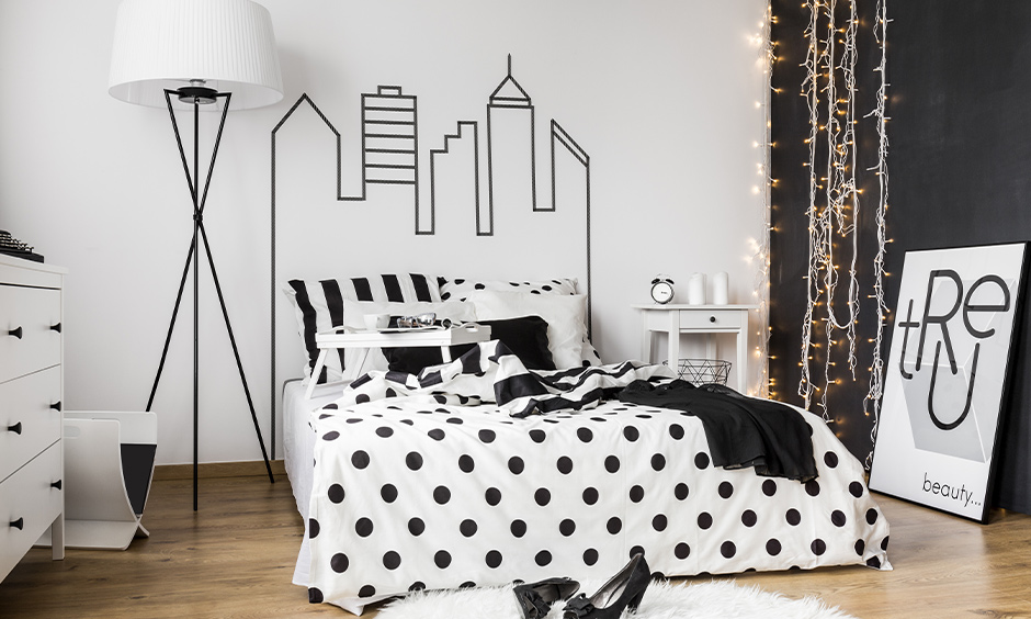 Bedroom black and white wall painting that represents a city's skyscrapers 