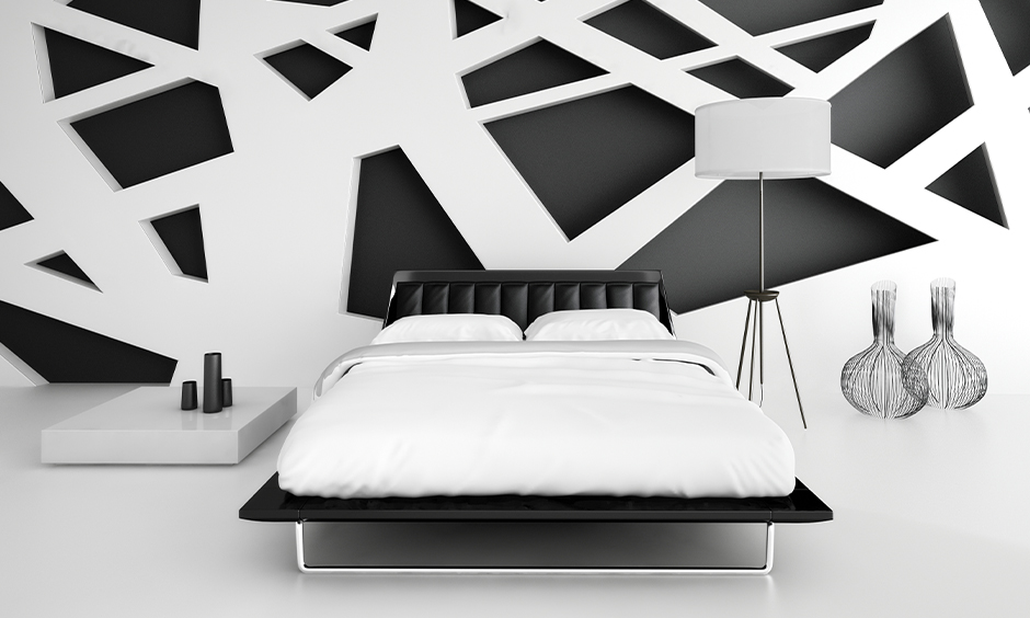 Black and white bedroom design with frosty white flooring that makes it look spacious