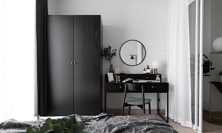 All-black colour dressing table with a chair in the bedroom looks elegant.