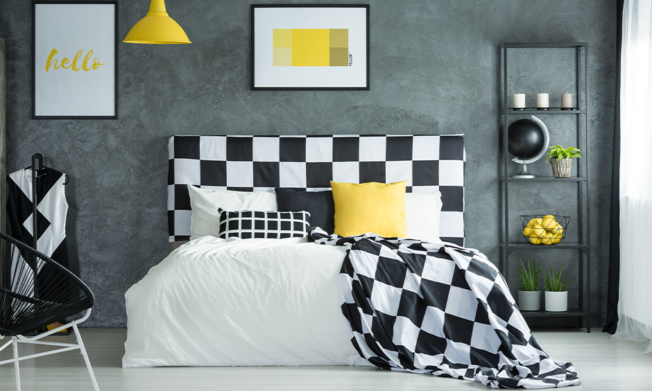 Charming checkers black and white bedroom design designed with a dark wall and a bed 