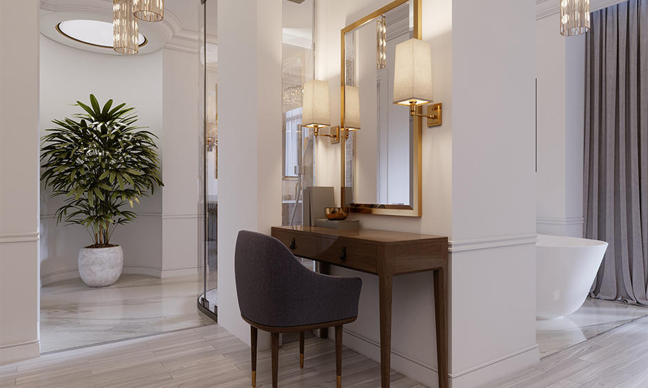 An old-school dressing table with wall lamps beside the gold-framed mirror is a dressing table light design