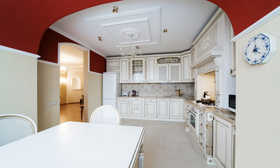 Creative modern arch design for kitchen with lustrous oxblood and glossy cream paint 