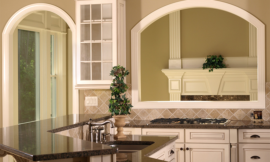 Double door kitchen arch designs inside home creating an inviting ambience