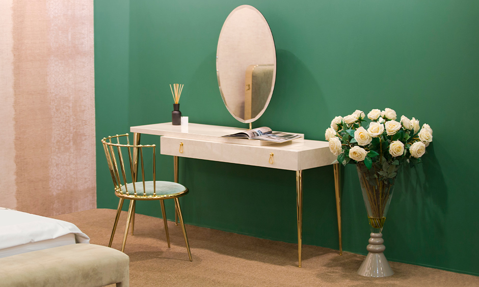 Gorgeous marble-white dressing table colour with golden legs spells luxury.