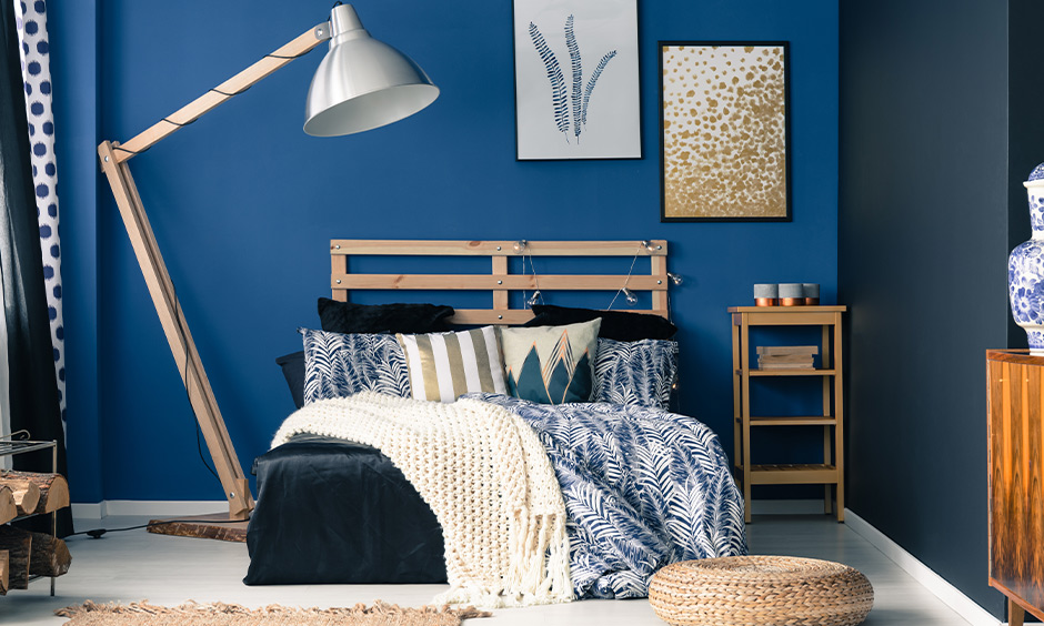 Bedroom wall coloured in a royal shade of blue look energetic, an idea for wall painting bedroom.