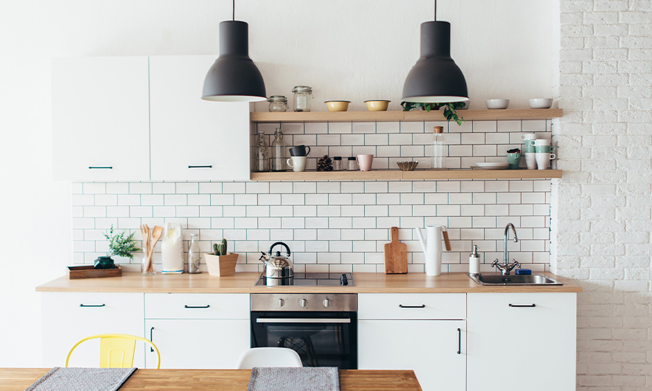 Two matt black hanging kitchen lights pendant in the white kitchen looks modern