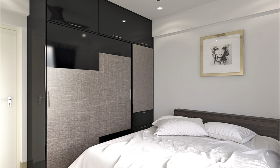 Home decor sliding wardrobe doors in black and silver lamination looks bold in the white bedroom.