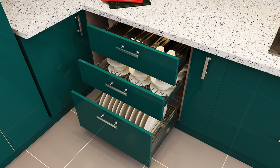 Internal drawers are base kitchen units designed in creen coloured internal drawers with cups, spoon and plates stored inside it.