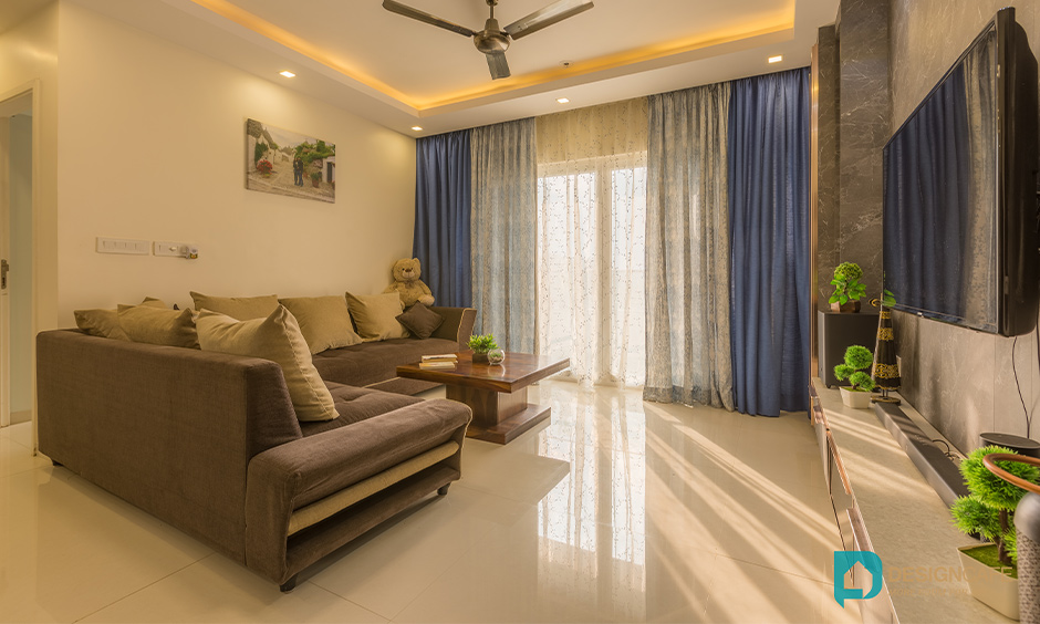 Living room design in 2bhk in bhoganhalli bengaluru with tv unit and wooden panelling look elegant.