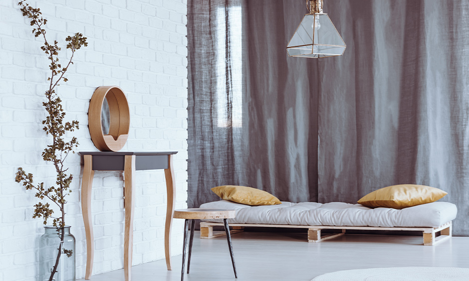 Minimal petite grey colour dressing table and stool in the bedroom look modern.