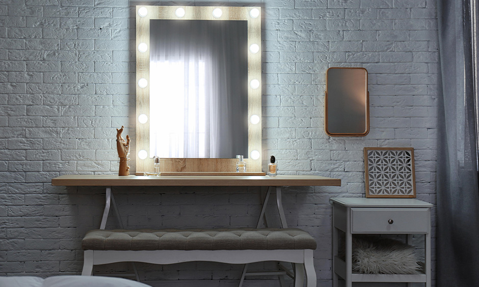 Dressing table colour combination in grey and wood with seating bench look elegant.