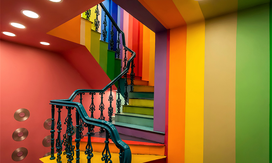 Staircase wall paint in rainbow colour is a great way to infuse personalisation