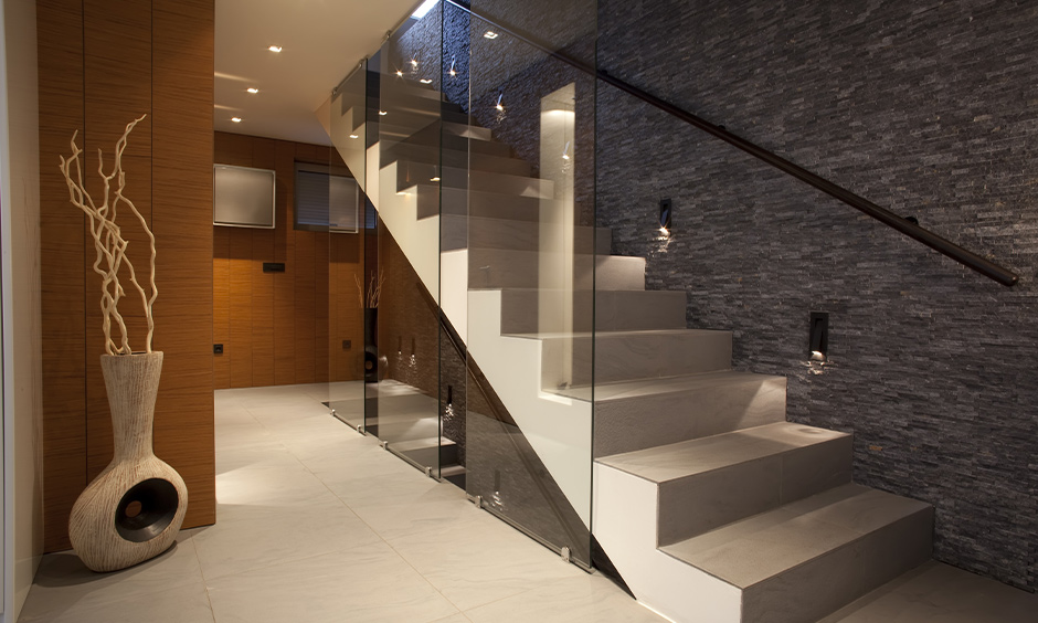 Staircase wall stairway decorating idea, a textured wall with built-in wall lights creates a dreamy pathway