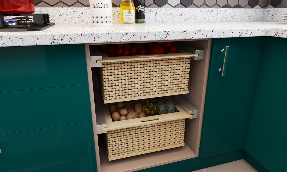 Pull-out basket with fruits and vegetables is an under-sink kitchen storage design.