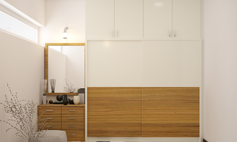 Dressing unit with mirror and drawers at a corner in the bedroom attached to the wardrobe, dressing table for small spaces