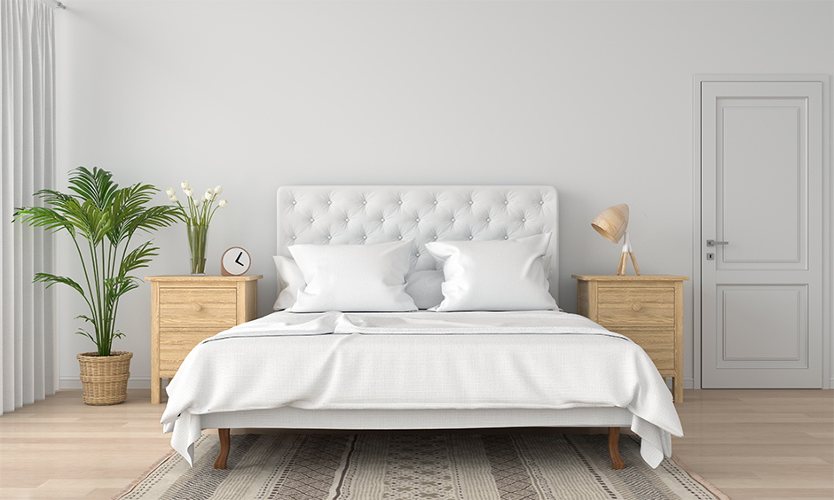 Bed design in white colour paired with a natural element