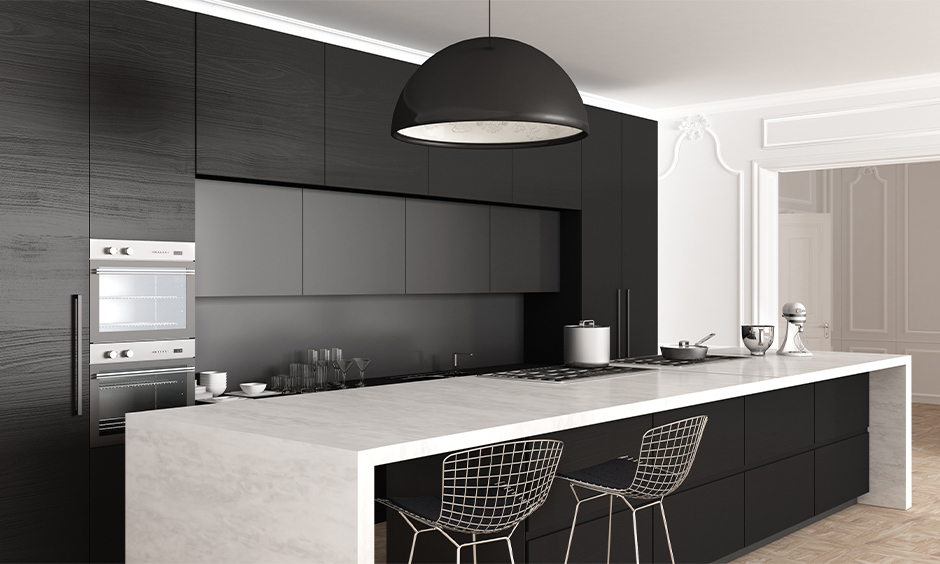 An island kitchen with black and grey kitchen cabinets combination