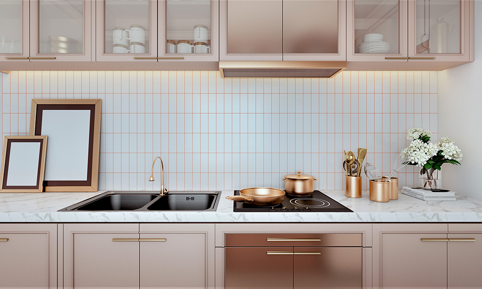 Black double bowl stainless steel kitchen sink blends well in rose gold kitchen interiors