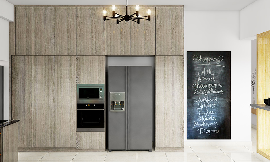 A chalkboard wall decor in the kitchen adds a rustic vibe to a modern kitchen space