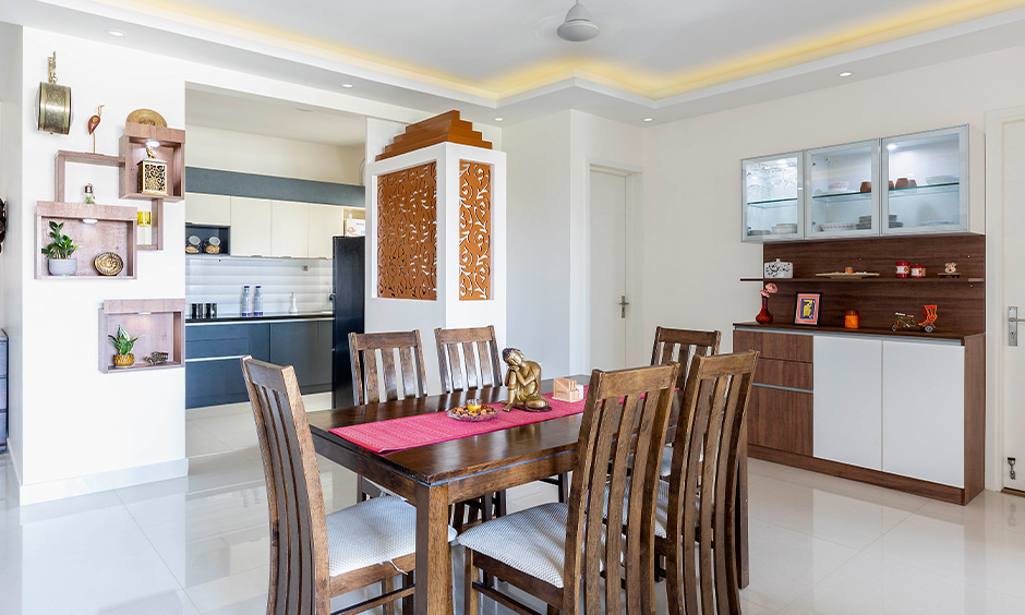 Best interior designer in Marathahalli designed this dining room with a classic dining table and display-cum-crockery unit.