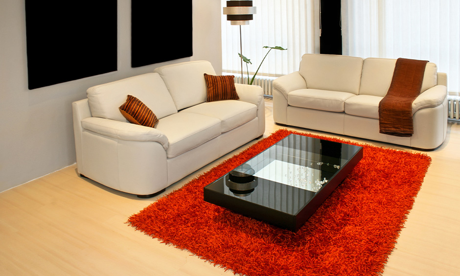 Red living room decor, red carpet flooring in the light blue living room adds vibrant.