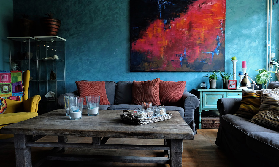 Living room ideas red painting on the wall and red cushions on sofa adds aesthetic to the area.