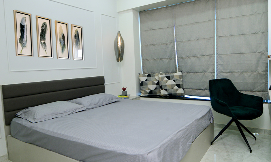 Budget interior designers in Mumbai designed a 2bhk white master bedroom interior with minimalist furniture