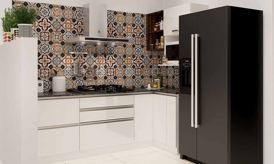 Modern kitchen wall tiles in pattern design with contrasting shades of black, yellow and blue looks charming.